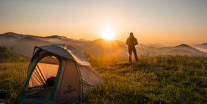 A man camping with a tent