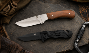 Compact full tang hunting knife with wood handle and black sheath displayed on a log at camp